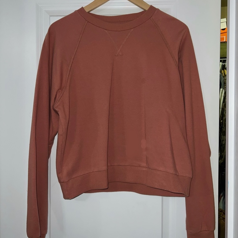 Pinkish tinted orange cropped sweatshirt